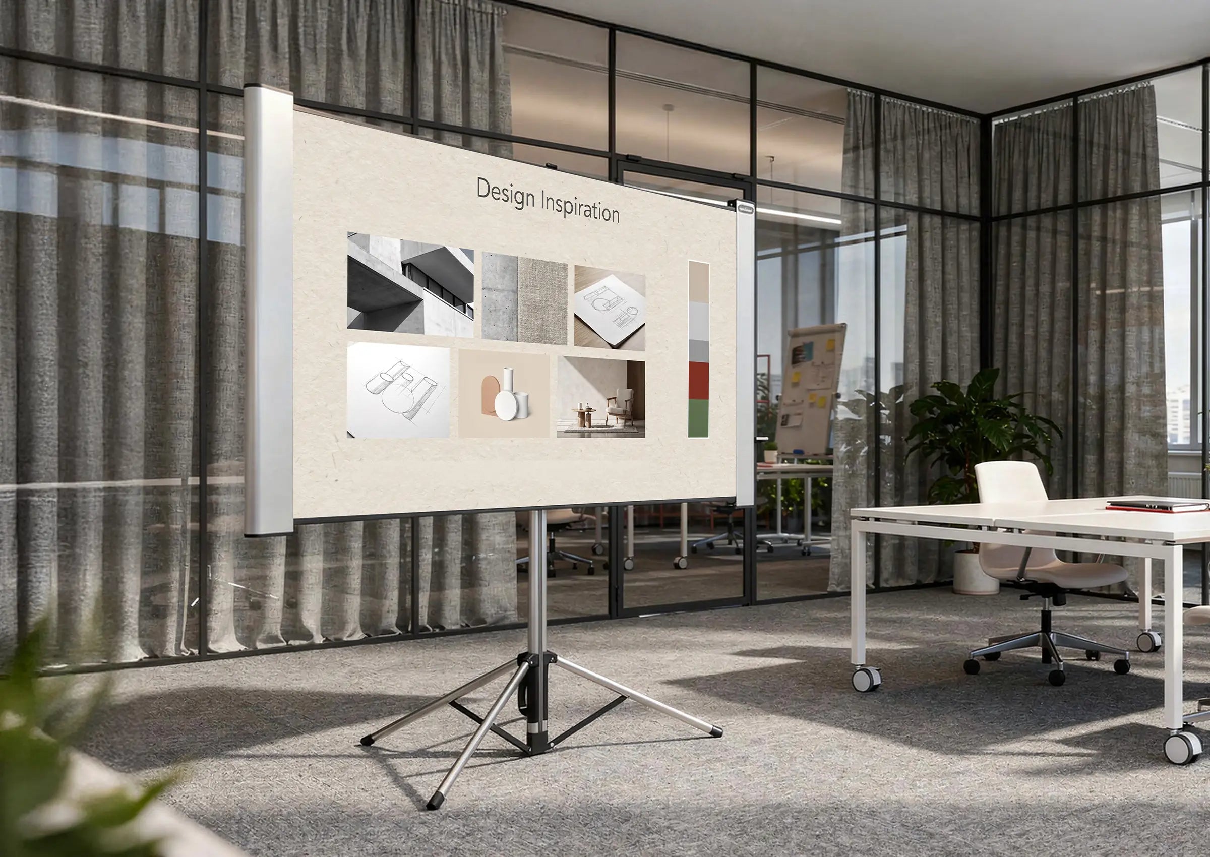 The image shows a modern workspace or creative studio with glass walls and open office structures. At the center stands a celexon Dual Format Tripod Screen Mobile Expert displaying a presentation titled “Design Inspiration,” consisting of various material, architecture, and design examples as well as a color palette.